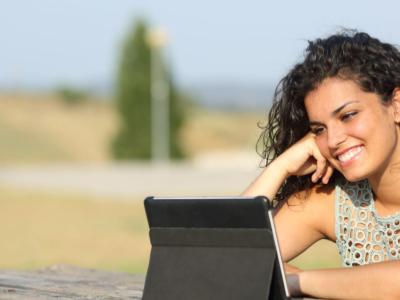 Woman watching on her tablet